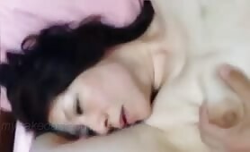 my naked asian girlfriend lays there as I jizz on her pretty face 